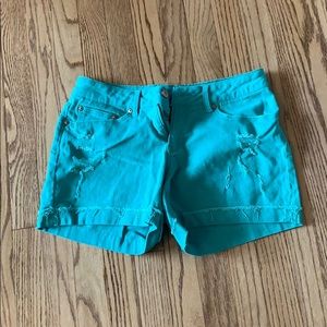 Ripped teal jean shorts